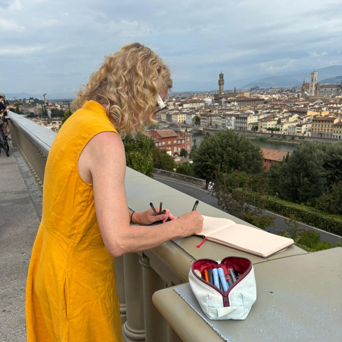A photo of one of our attendees sketching the Florence cityline