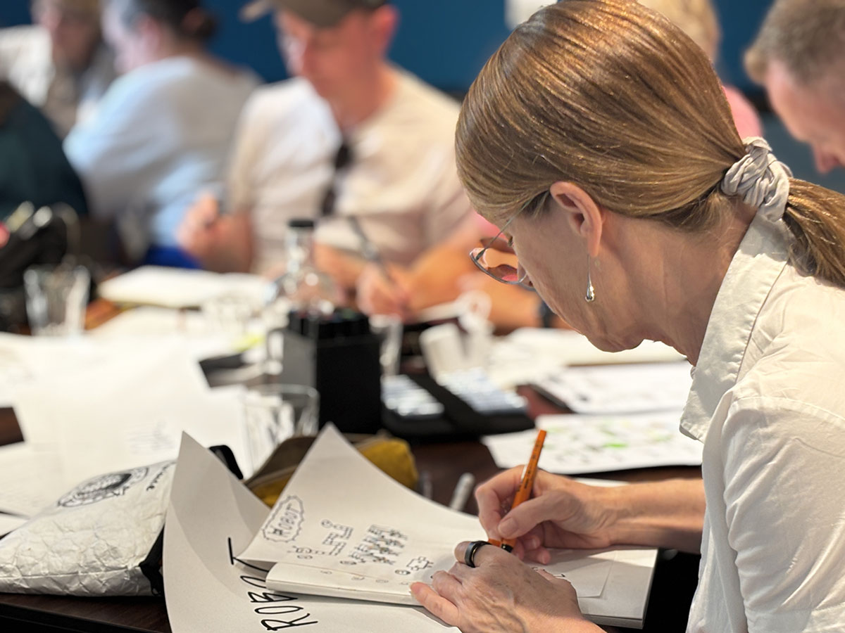 A photo of another workshop attendee drawing during an activity