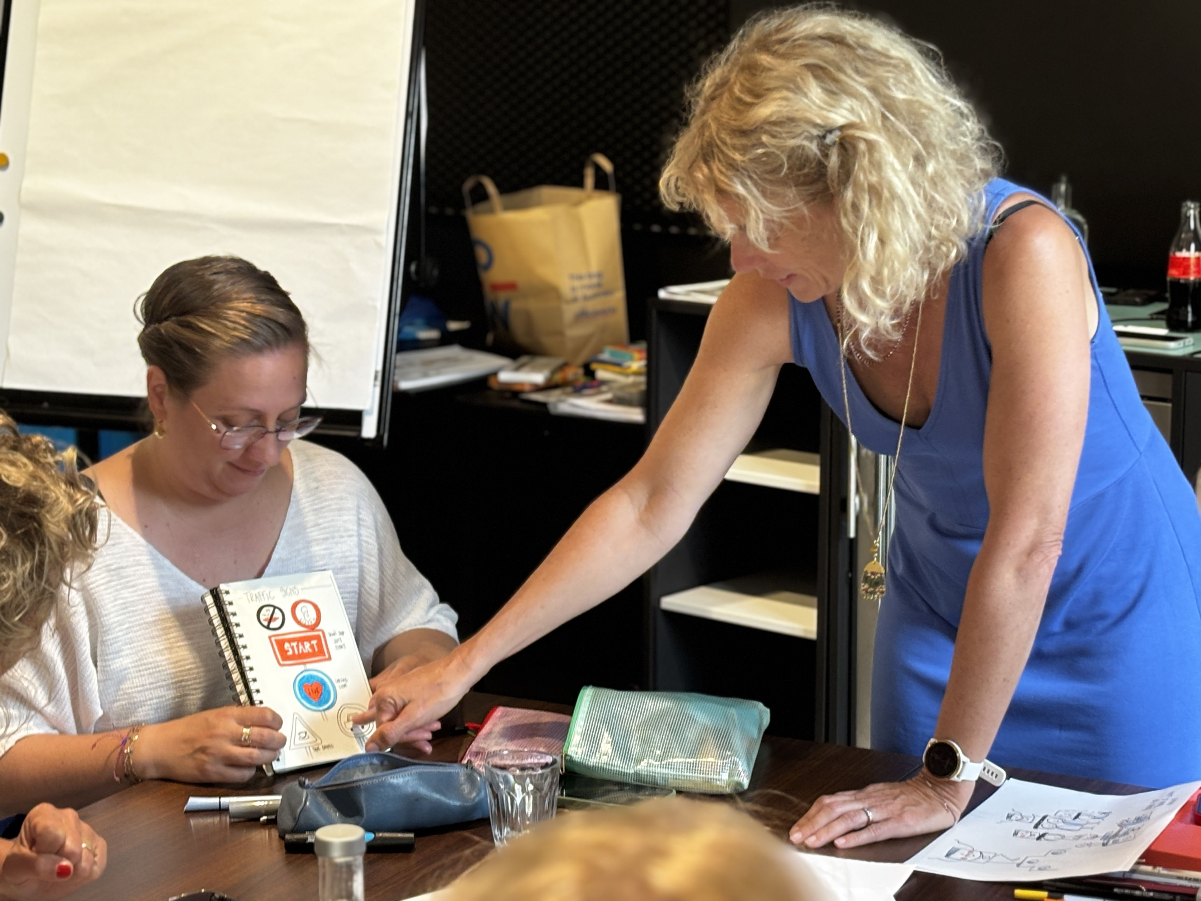 A photo of Axelle giving advice to a workshop attendee