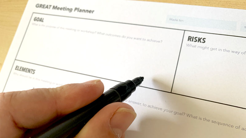 A picture of the GREAT meeting planner template printed out