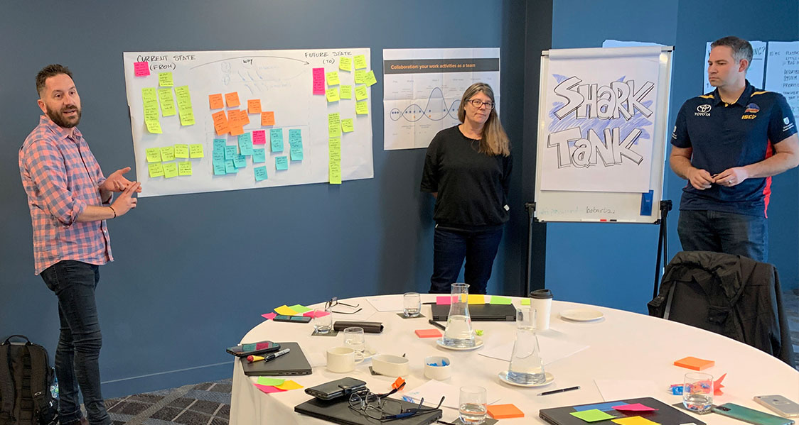 A photo of someone capturing their thoughts using a Research Canvas, bespoke designed by Bright Pilots