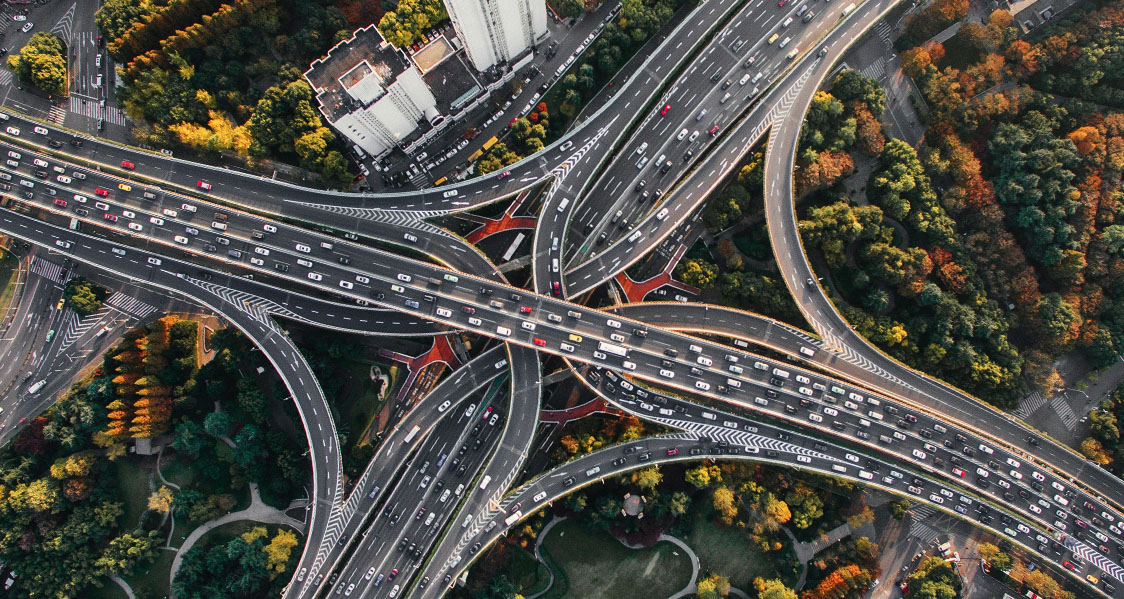 A photo showing an overhead view of a busy multilane road intersection